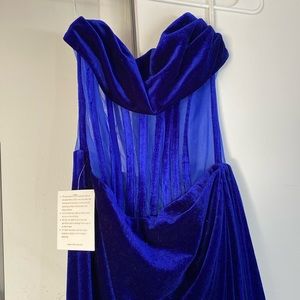 I’m selling a dark blue corset style, sleeveless dress.